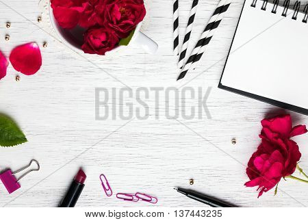 Pretty feminine stuff on the white background with negative space top view