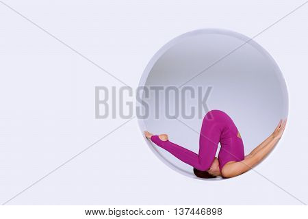 stylish and sporty woman active wear practicing gymnastic exercises in geometric design of round shapesin sphere. Creative concept sports white background. Empty space text
