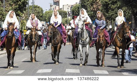 SELARGIUS, ITALY - September 14, 2014: Former marriage Selargino - Sardinia - group of women in Sardinian costume parade on horseback