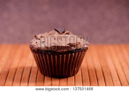 One Isolated Chocolate Muffin With Hazlenut Dark Chocolate Cream
