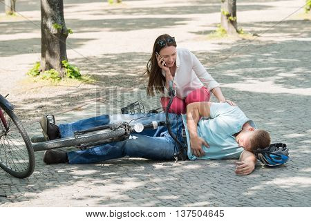 Worried Woman Calling For Help After Man Getting Injured By Falling From Bicycle