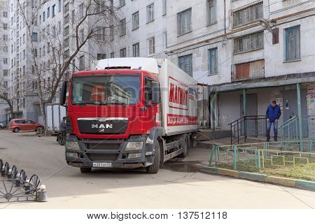 Nizhny Novgorod Russia. - April 14.2016. Cargo fura drove backwards to the rear entrance of the store MAGNET unloading goods. Street Sovnarkomovskaya 26.
