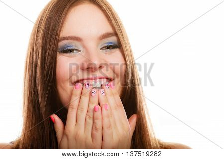 Lovely woman lauging. Smiling girl covers her mouth with hands showing pink nails design on white