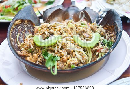 spicy Salad made with horseshoe crab eggs and mix vegetable on shell horseshoe crab