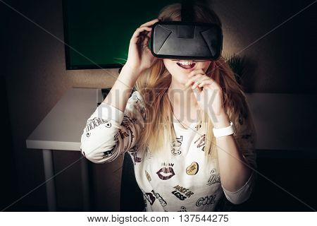 blonde girl playing and enjoy in virtual reality
