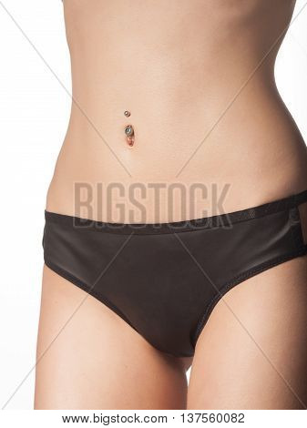 Slim tanned woman's body.Beautiful sexy female slim tanned body. Studio shot on white background.