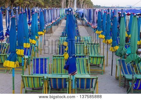 View of beach chair and umbrella on the beach
