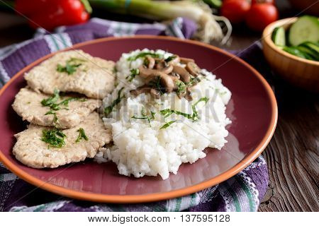 Pork loin fillets with rice and mushrooms