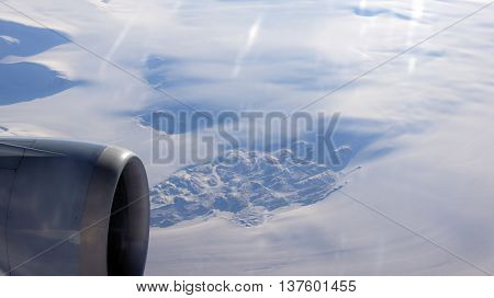 Greenland as seen from the sky out of an airplane