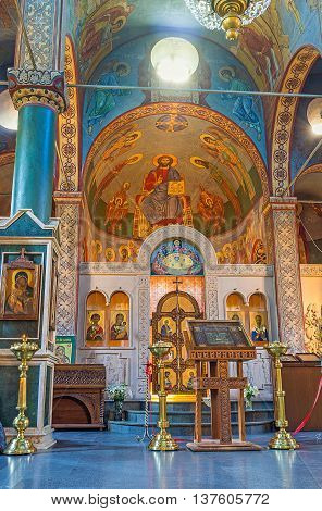 BATUMI GEORGIA - MAY 24 2016: The colorful murals on the apse of St Nicholas Church and the carved stone iconostasis on May 24 in Batumi.