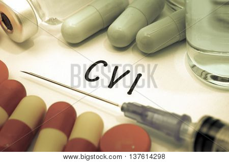 CVI - diagnosis written on a white piece of paper. Syringe and vaccine with drugs.