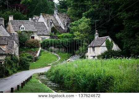 Traditional Cotswold cottages in England, UK. Bibury is a village and civil parish in Gloucestershire, England.