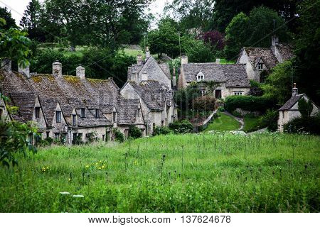 Traditional Cotswold cottages in England, UK. Bibury is a village and civil parish in Gloucestershire, England.