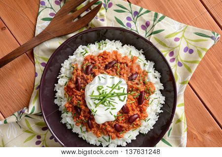 Mexican food Chili con carne on a wooden background