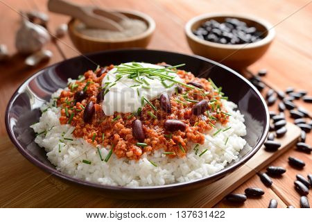 Mexican food Chili con carne on a wooden background