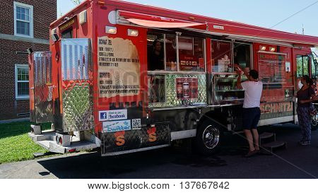 NEW YORK, NY - JUN 19: Food trucks at Governors Island in New York, as seen on Jun 19, 2016. It is a 172-acre island and is part of the borough of Manhattan in New York City.