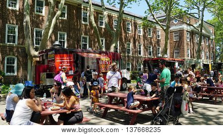 NEW YORK, NY - JUN 19: Food trucks at Governors Island in New York, as seen on Jun 19, 2016. It is a 172-acre island and is part of the borough of Manhattan in New York City.