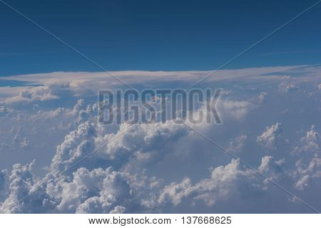 Beautiful blue sky and cloud view from an airplane window.