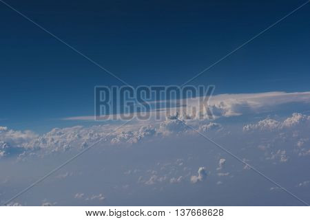 Beautiful blue sky and cloud view from an airplane window.