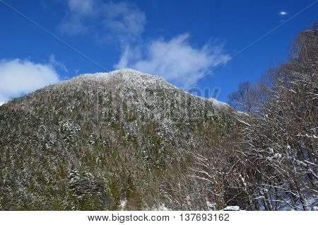 A mountain covered with white snow in Oku-Hida Japan.