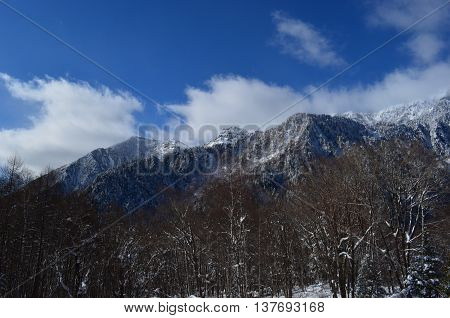 A mountain covered with white snow in Oku-Hida Japan.