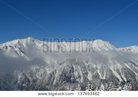 A mountain covered with white snow in Oku-Hida Japan.