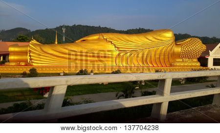 The 99 ft Laem Phor Reclining Buddha, back view, as seen from the highway, Ko Yo Island, Thailand