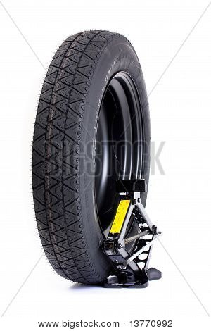 Car wheel and jack isolated