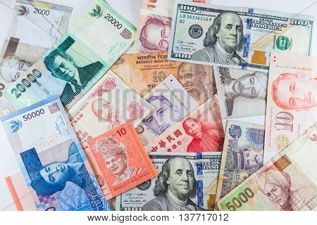 Multiple Currencies banknotes as colorful background showed the global money financial business economy crisis