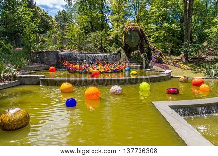 ATLANTA GA USA - APRIL 23 2016: Exhibition of glass artist Chihuly takes place in the Atlanta Botanical Garden in Atlanta Georgia in 2016.
