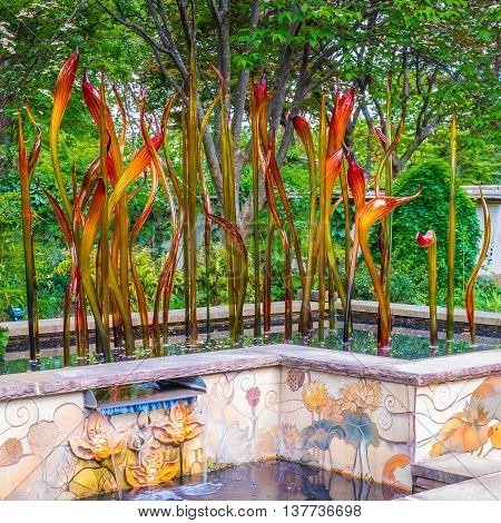 ATLANTA GA USA - APRIL 23 2016: Exhibition of glass artist Chihuly takes place in the Atlanta Botanical Garden in Atlanta Georgia in 2016.