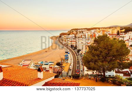 SANT POL DE MAR, SPAIN - FEBRUARY 12: Sunset over Sant Pol de Mar, an idyllic village on the Mediterranean coast, Catalonia, Spain