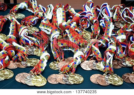 Medals with ribbons for the competition on the table