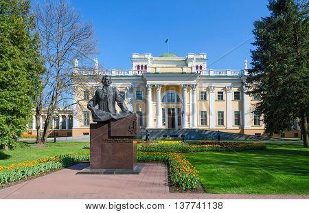 GOMEL BELARUS - APRIL 29 2016: Palace of Rumyantsev-Paskevich and monument to Count Rumyantsev in spring park Gomel Belarus