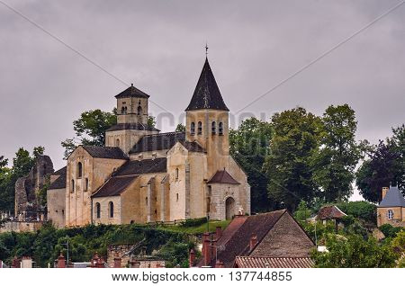 Medieval church and stone buildings in a small town in France