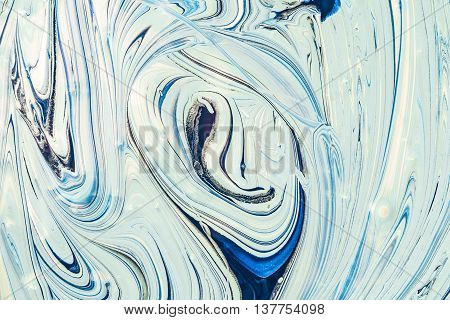 Mixing blue color scheme with a bright white interior with acrylic paint. Mix liquid paint. Abstract texture.