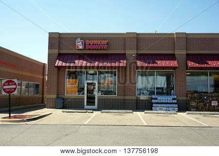 PLAINFIELD, ILLINOIS / UNITED STATES - APRIL 14, 2016: One may eat doughnuts at the Dunkin' Donuts shop in Plainfield.