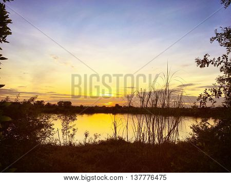 Sunrise at the Golden Lake in the morning.