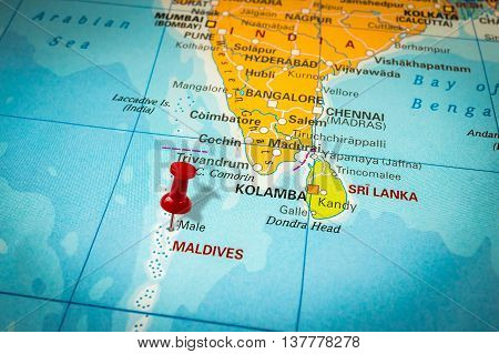 Red Thumbtack In A Map, Pushpin Pointing At Maldives