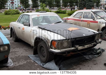 PERM RUSSIA - JUNE 29 2016: Rally of retro-cars Peking-Paris 2016 June 29 2016 in Perm Russia. Mercedes 450 SLC is in the city after the next stage.