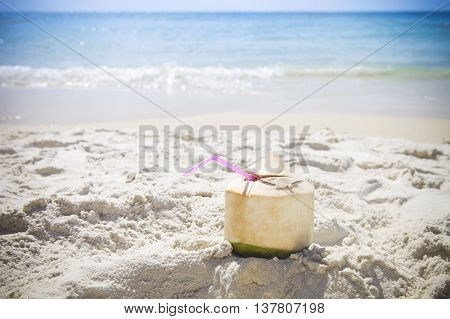 Fresh coconut cocktail on the tropical beach