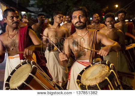 Kochi, India -  December 31, 2015: Traditional south indian drummers performing on streets of Kochi, Indian