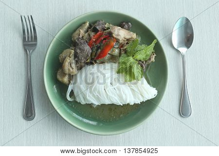 Curry chicken noodles (KHANOM CHIN) with vegetableThis is local Thai foods in Vermicelli rice.