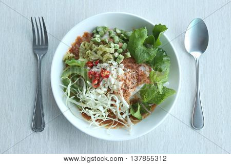 Local Thai foods of Rice Vermicelli is name KHANOM CHINspicy noodles with vegetable and hot soup.