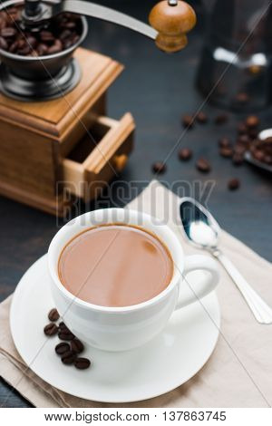 Coffee Cup And Vintage Coffee Mill With Coffee Maker Pot On Old Wooden Table
