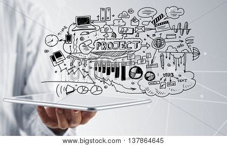 Businessman hand demostrating business strategy plan on tablet screen