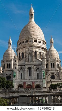 The Sacre Coeur basilica is a Roman Catholic church located at the summet of the butte Montmartre the highest point in Paris.