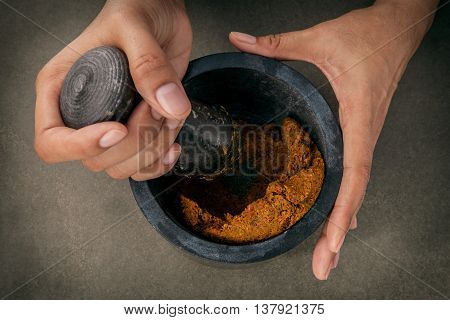 The Women Hold Pestle With Mortar And And Spice Red Curry Paste Ingredient Of Thai Popular Food On D