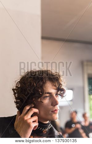 MILAN ITALY - JUNE 19: Beautiful model poses in the backstage just before Damir Doma SS 17 show during Milan Men's Fashion Week on JUNE 19 2016 in Milan.
