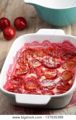 Plum clafoutis in a baking dish